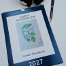 Květy akvarelem - kalendář 2027,s modrým rámováním