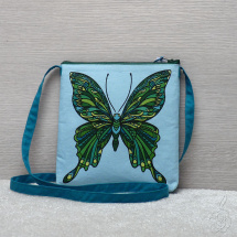 Modrozelená kabelka s motýlem