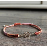 Náramek Shamballa s kovovým ornamentem