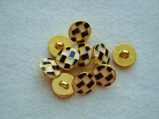 Plastový knoflík.
