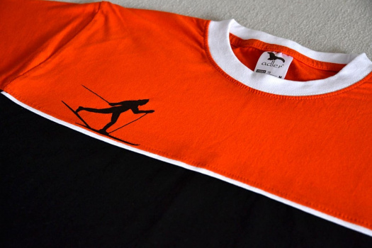 Oranžovo-černé tričko s černým běžkařem M