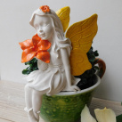 Víla s kytkou dekorace barevná rohová sedící