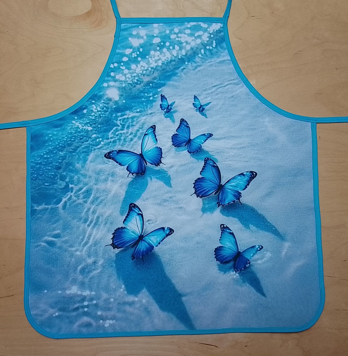 Zástěra malá motýlci na pláži 