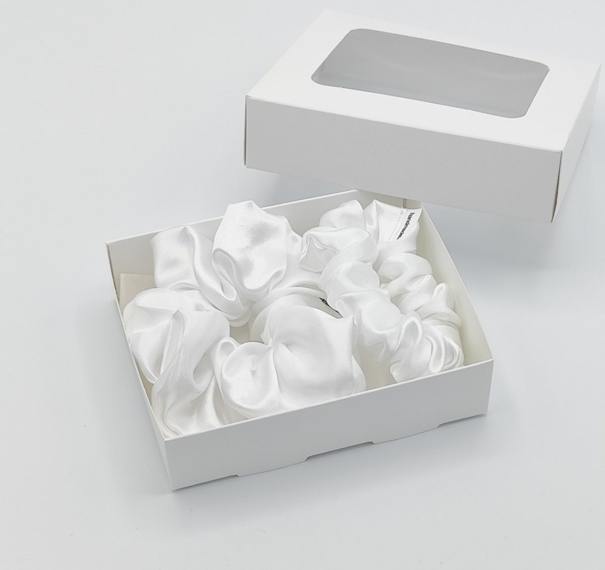 Sada dvou bílých gumiček L-klasik a S