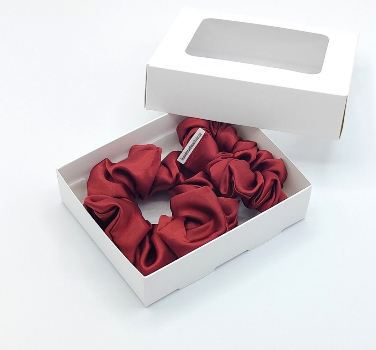 Sada dvou tmavě červených gumiček L-klasik a S