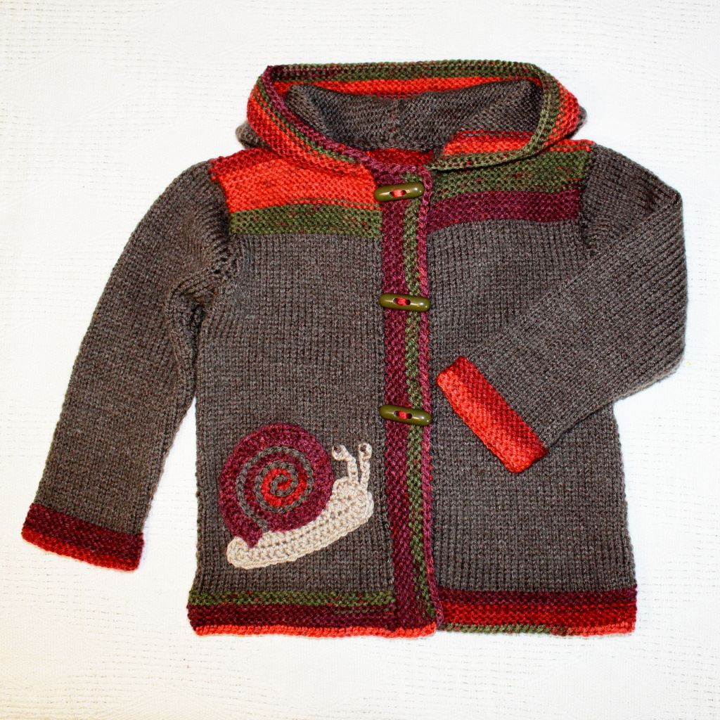 Pletený kabátek se šnekem