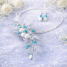 Ručně vyráběný květinový náhrdelník a náušnice v tyrkysové s peřím