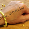 Náramek kulička žlutý